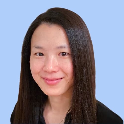 Vicki Mar headshot blue background