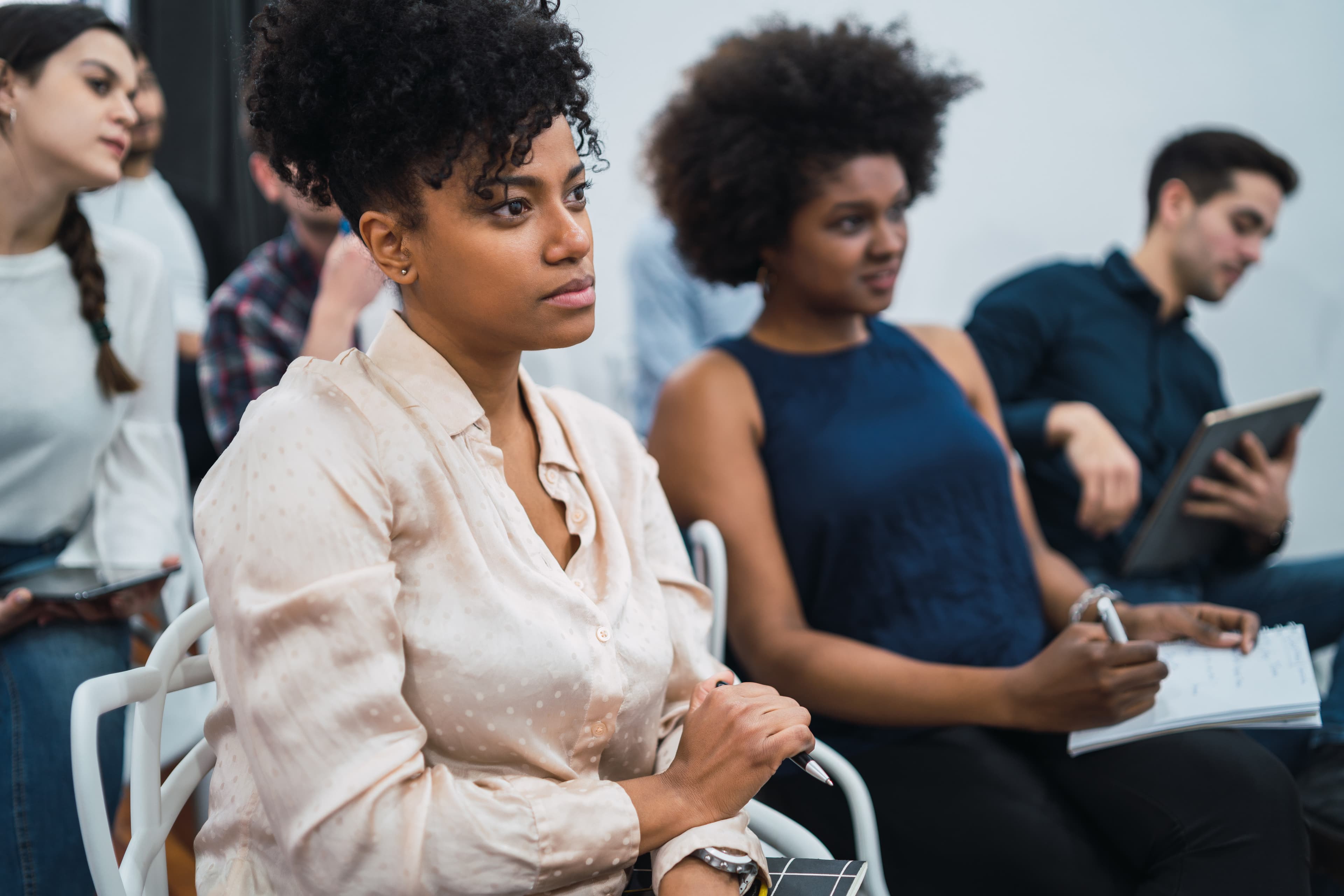 Adults listening to a talk