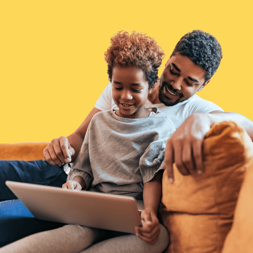 dad and son on laptop