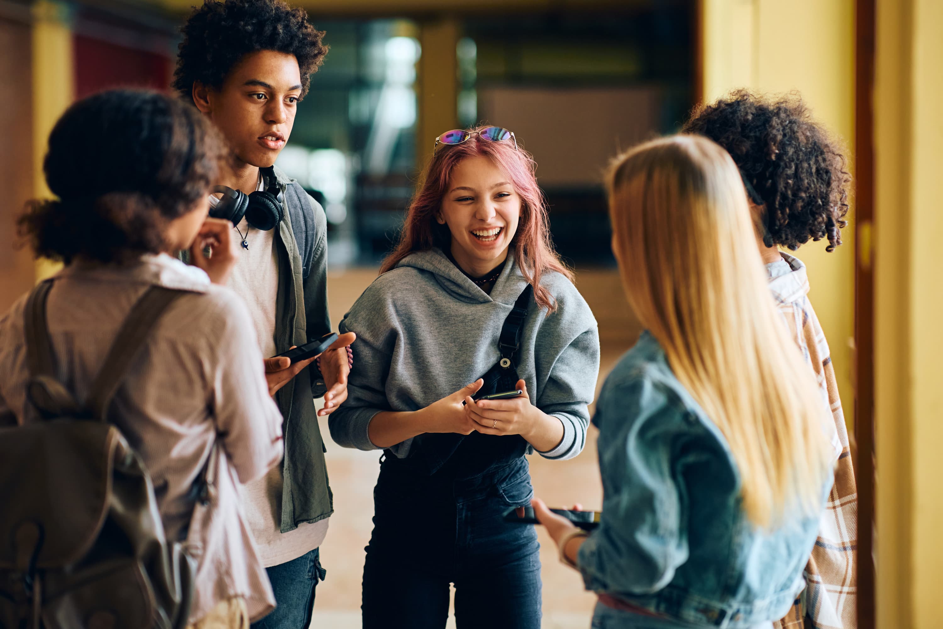 teens socializing in hallway